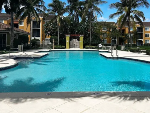 a view of a patio with swimming pool table and chairs