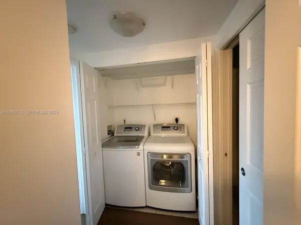 a utility room with dryer and washer