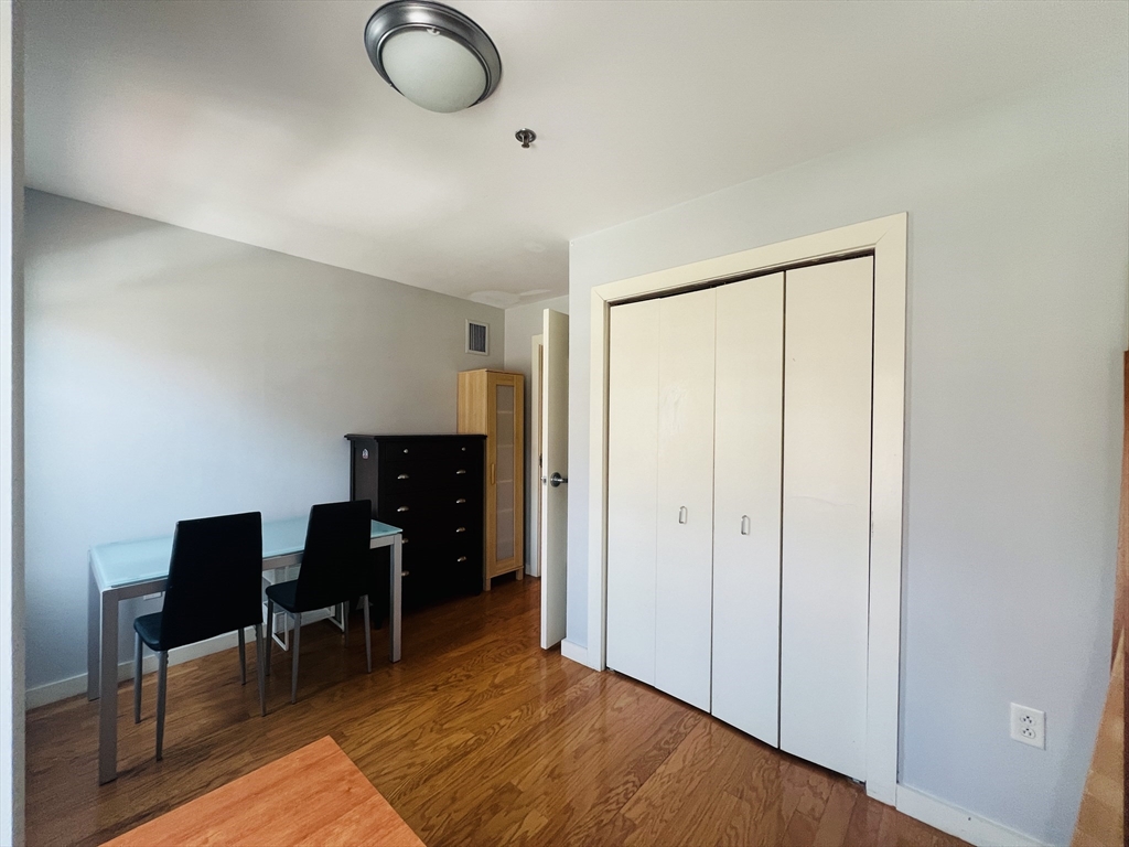 534 Commonwealth Avenue, Unit 3A Boston, MA 02215 - Photo 6 of 15 a view of workspace room with wooden floor and furniture
