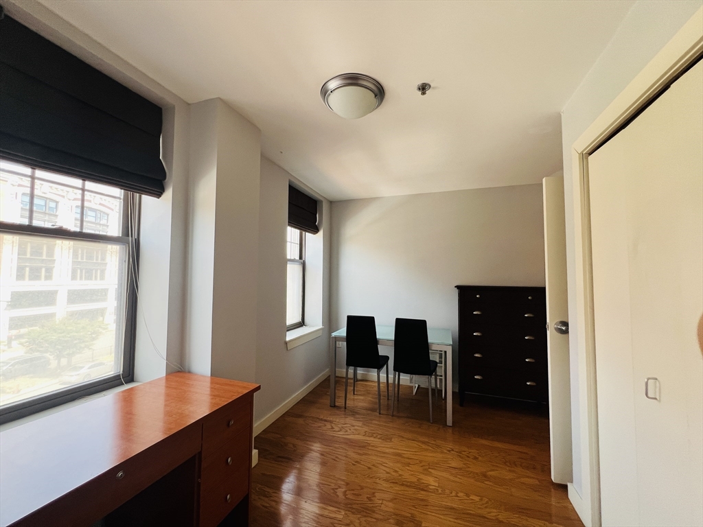 534 Commonwealth Avenue, Unit 3A Boston, MA 02215 - Photo 7 of 15 a view of room with window and wooden floor