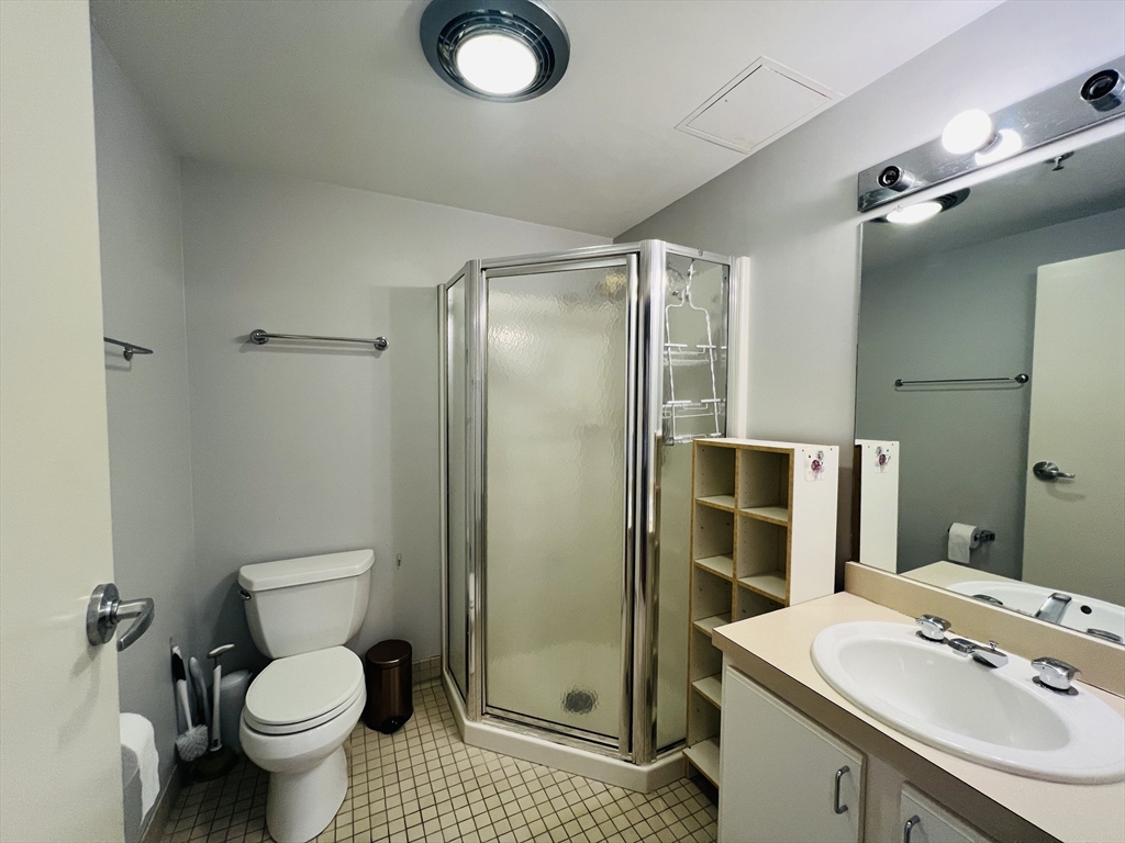 534 Commonwealth Avenue, Unit 3A Boston, MA 02215 - Photo 8 of 15 a bathroom with a sink toilet and shower