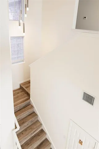 a view of a hallway with stairs