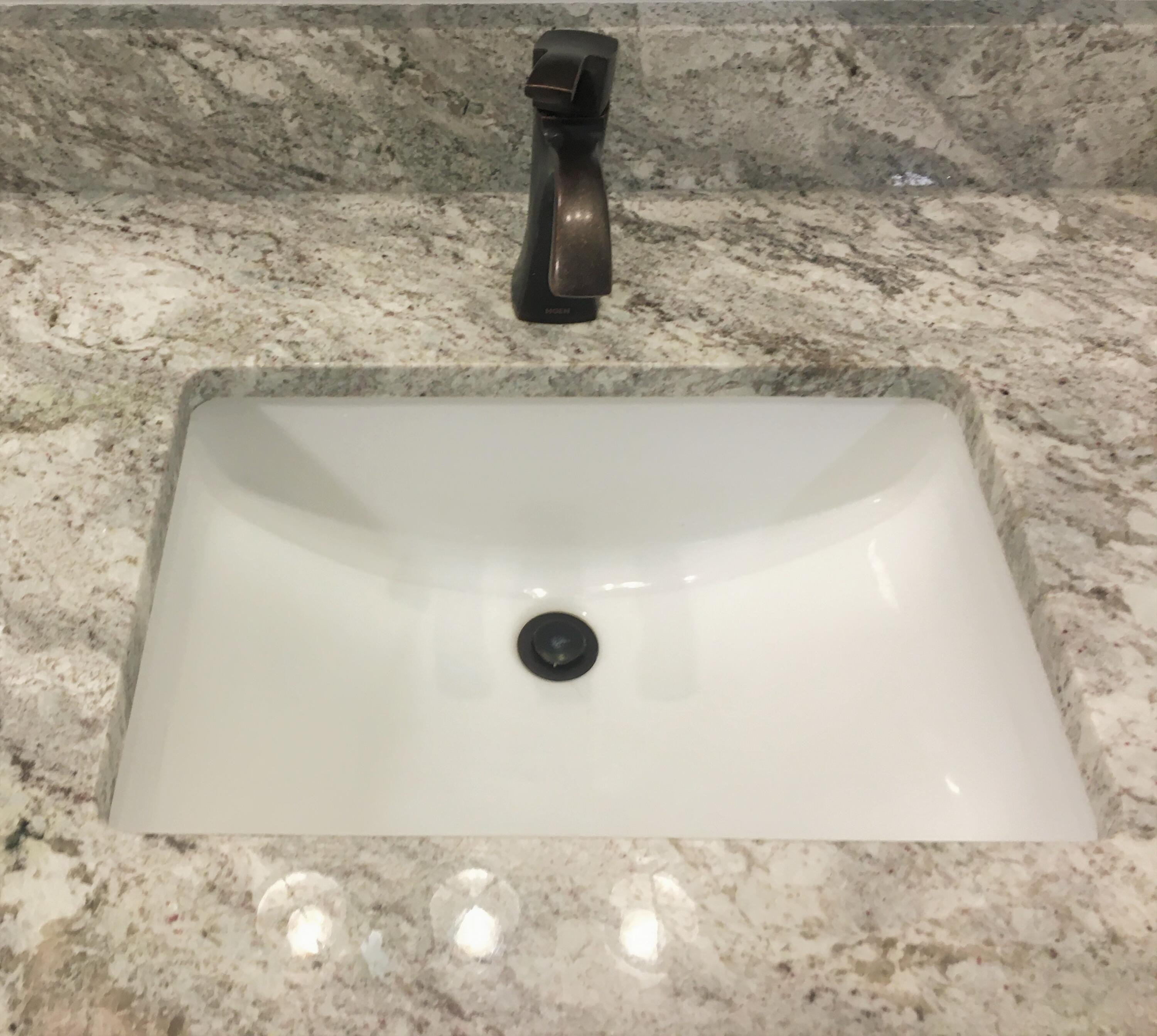 19166 Buck Canyon Road Bend, OR 97702 - Photo 24 of 63 Granite counter rubbed brass fixtures