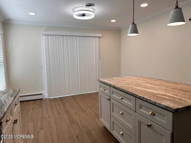 an empty room with wooden floor