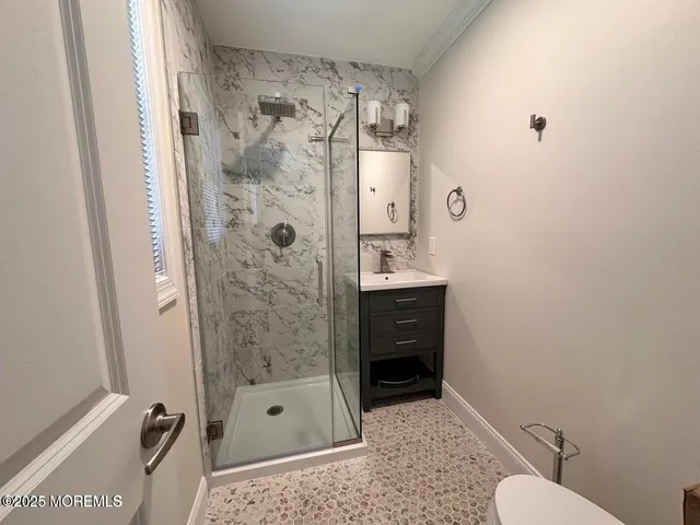a bathroom with a shower and a toilet