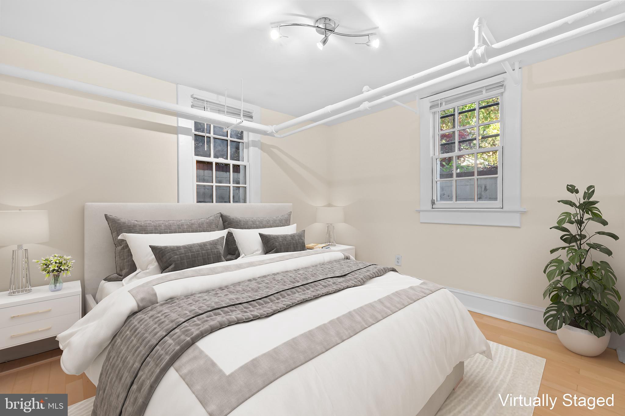 3001 Porter Street Northwest, Unit 100 Washington, DC 20008 - Photo 7 of 22 a bedroom with bed and a window