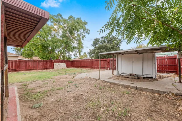 an aerial view of a house with yard