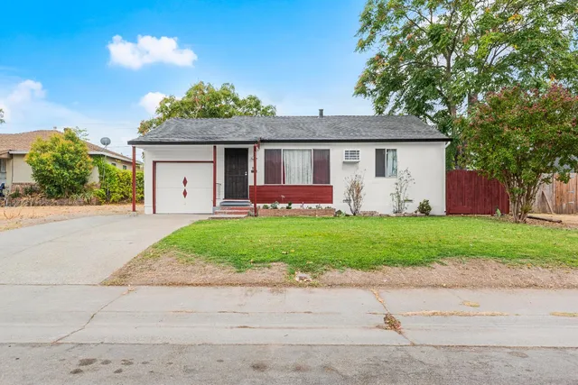 front view of a house with a yard