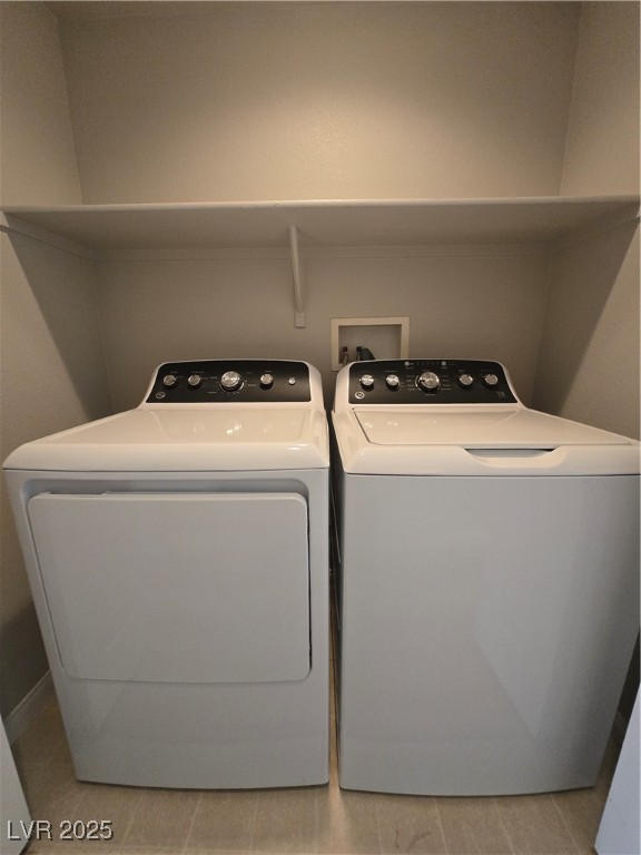 10966 Sutter Hills Avenue Las Vegas, NV 89144 - Photo 17 of 18 Laundry area featuring light tile patterned floors and independent washer and dryer