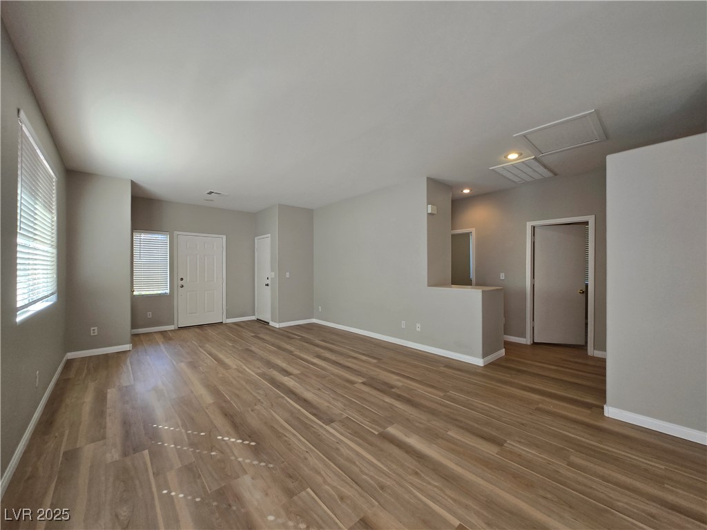 10966 Sutter Hills Avenue Las Vegas, NV 89144 - Photo 5 of 18 Spare room featuring wood finished floors and recessed lighting