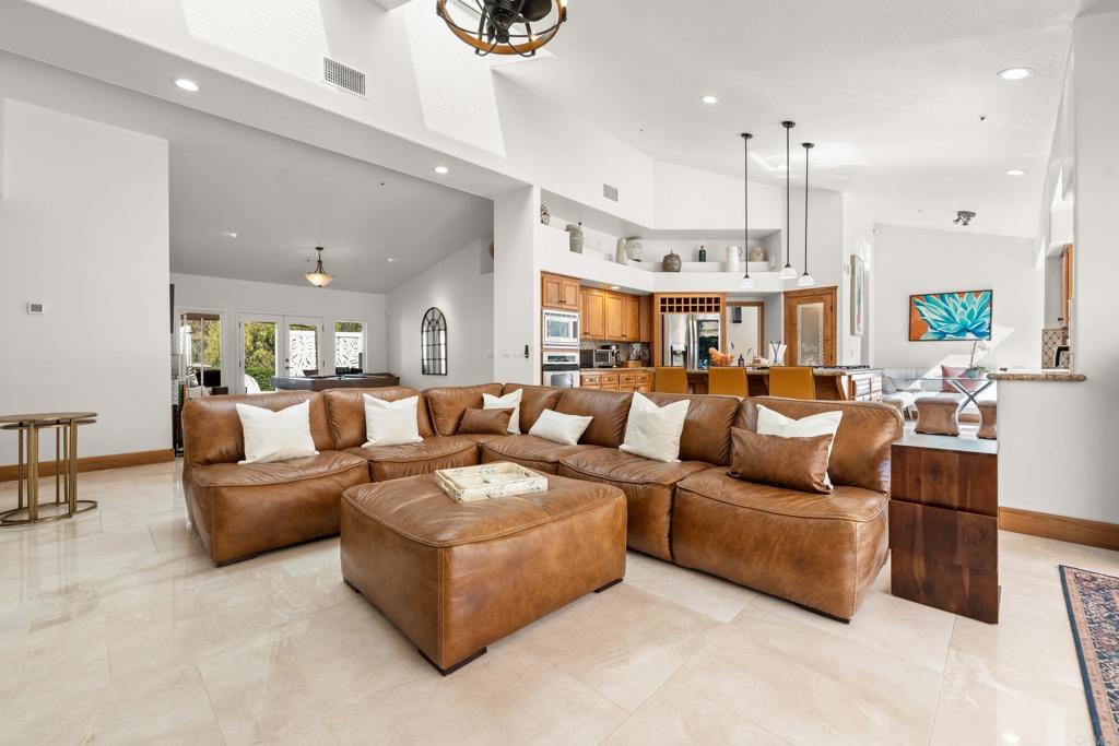 3427 Bumann Road Encinitas, CA 92024 - Photo 12 of 37 a living room with furniture kitchen view and a chandelier