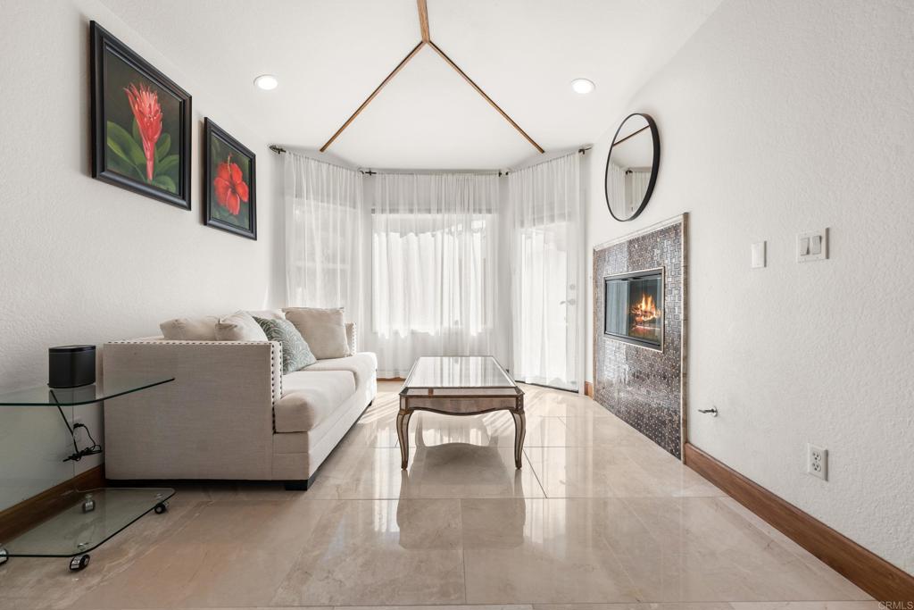 3427 Bumann Road Encinitas, CA 92024 - Photo 19 of 37 a living room with furniture a flat screen tv and a window