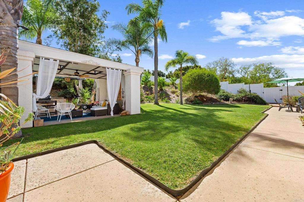 3427 Bumann Road Encinitas, CA 92024 - Photo 27 of 37 a view of a backyard with plants and a patio