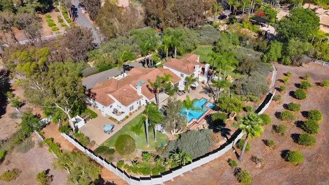 an aerial view of house with yard