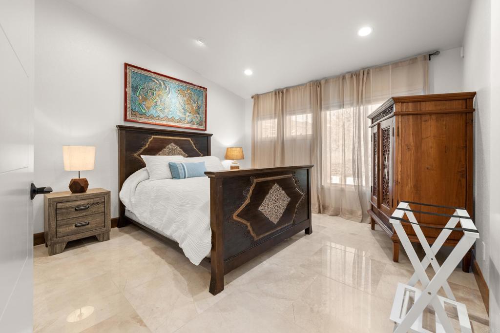 3427 Bumann Road Encinitas, CA 92024 - Photo 36 of 37 a bedroom with a bed and wooden floor