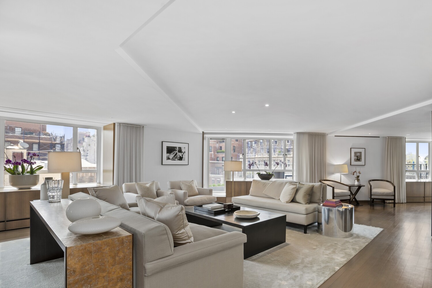 799 Park Avenue, Unit 19BC Manhattan, NY 10021 - Photo 1 of 12 a living room with furniture and a large window