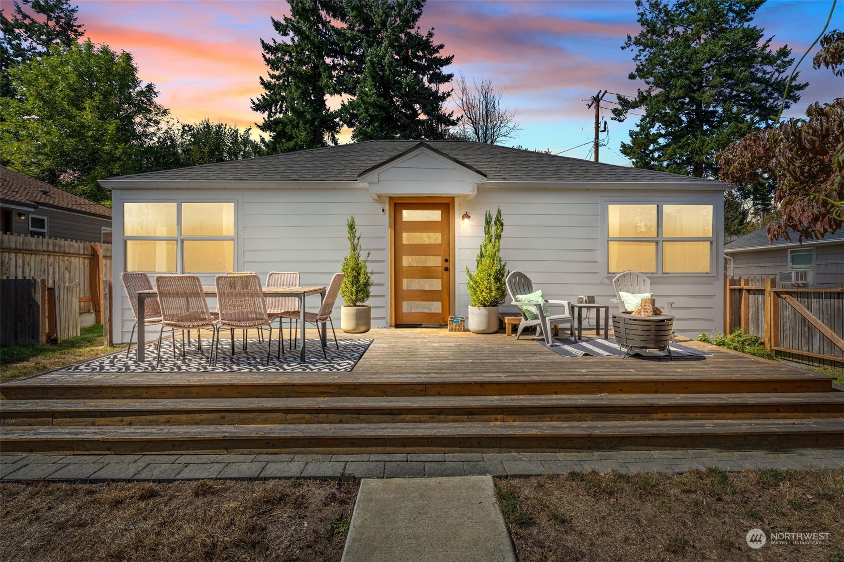 7911 18th Avenue Southwest Seattle, WA 98106 - Photo 1 of 32 a view of house with couch and floor to ceiling windows