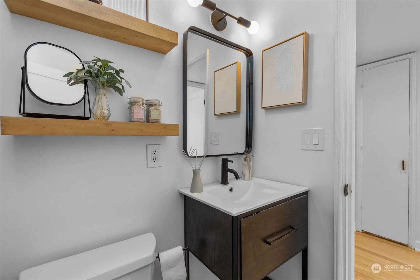7911 18th Avenue Southwest Seattle, WA 98106 - Photo 19 of 32 a bathroom with a sink and a mirror