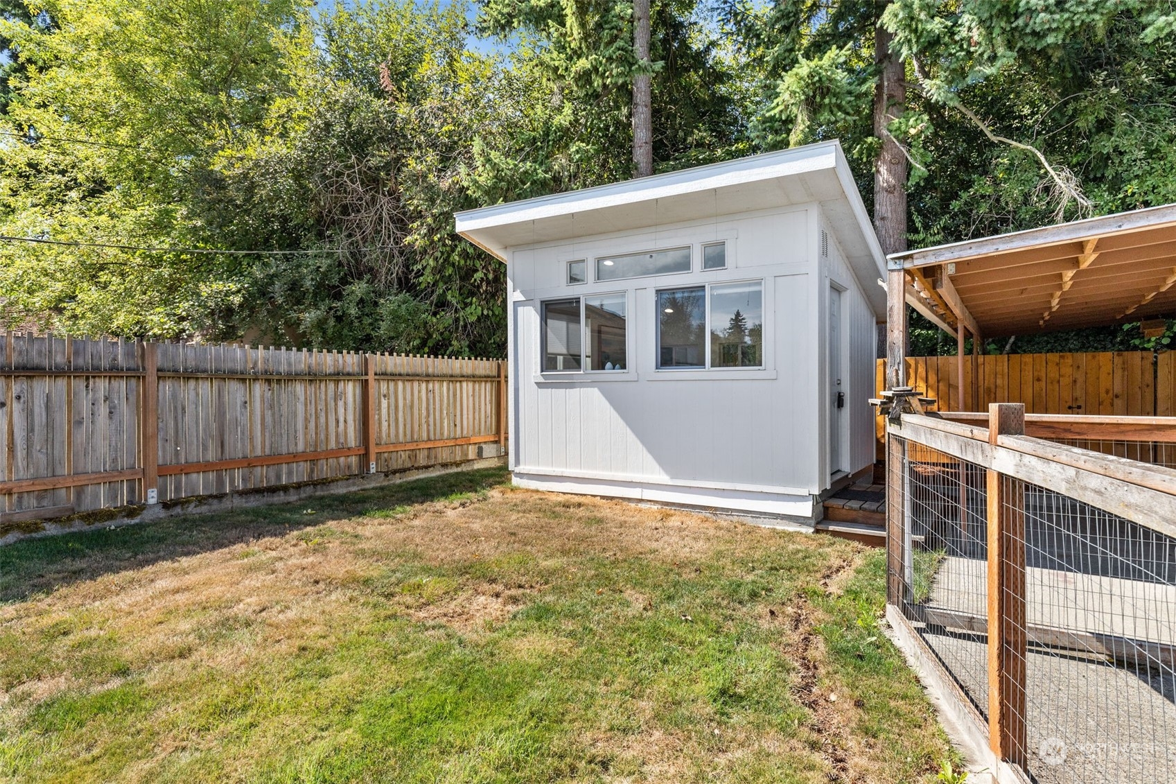 7911 18th Avenue Southwest Seattle, WA 98106 - Photo 21 of 32 a view of a house with a backyard
