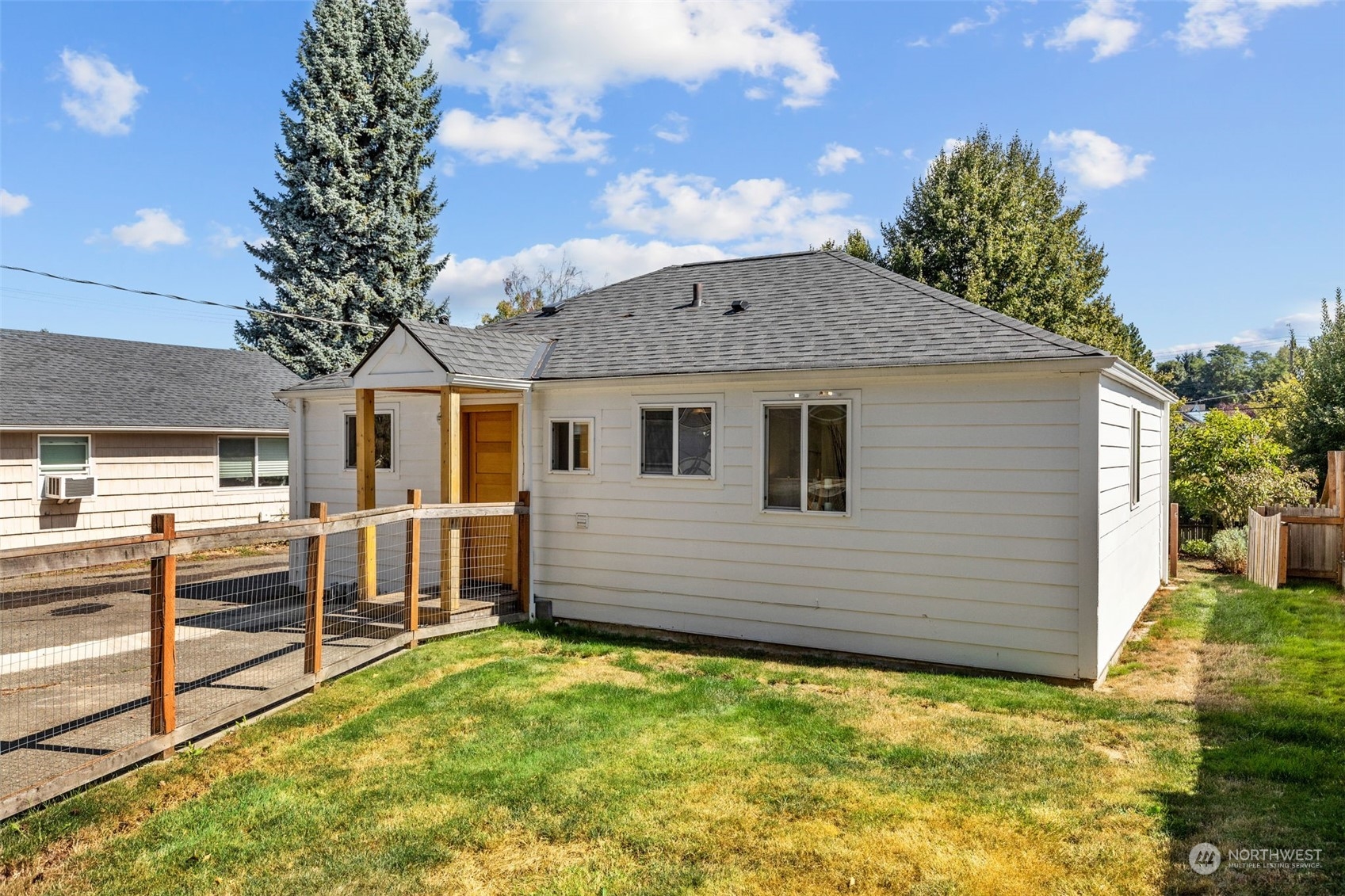 7911 18th Avenue Southwest Seattle, WA 98106 - Photo 26 of 32 a view of a house with a backyard