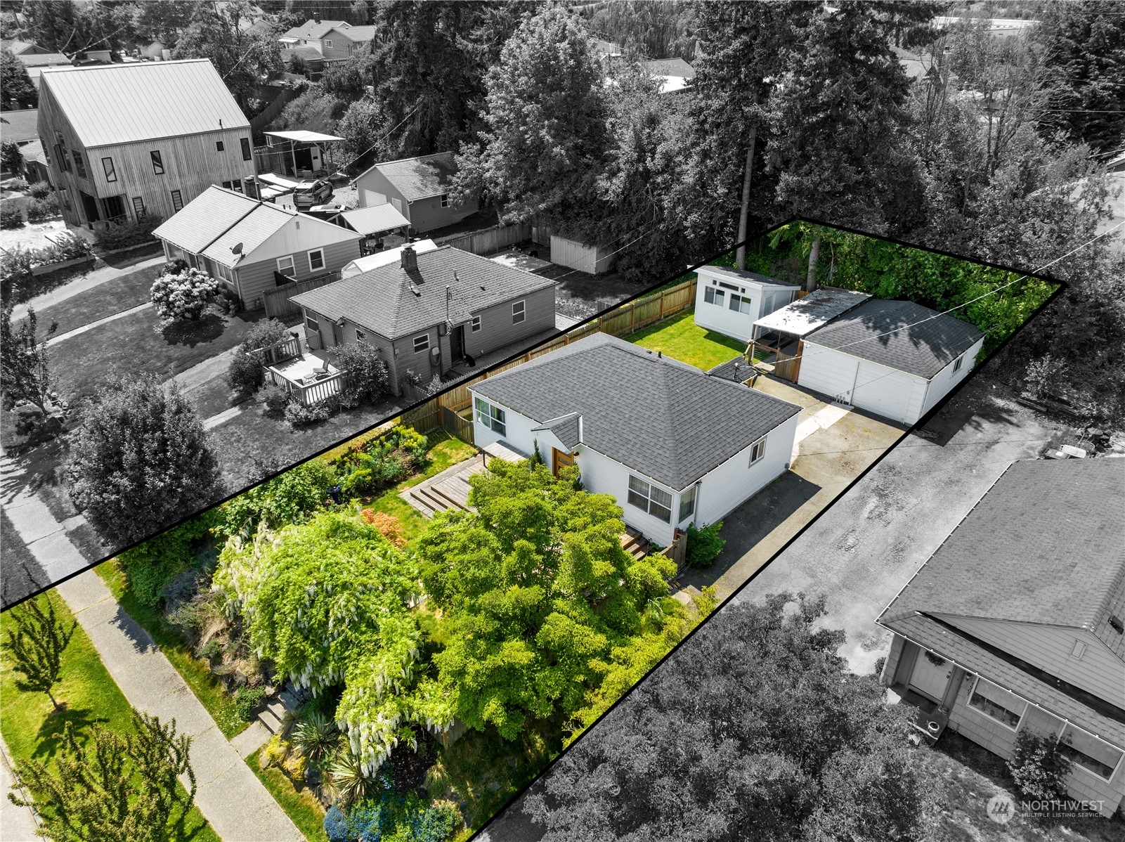 7911 18th Avenue Southwest Seattle, WA 98106 - Photo 29 of 32 an aerial view of a house with a garden and lake view