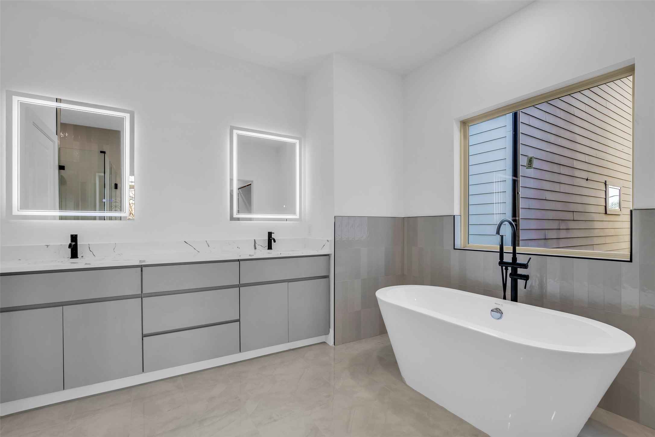 1506 Griffin Street Houston, TX 77009 - Photo 33 of 38 Stylish in glass vanity lighting and large soaking tub.