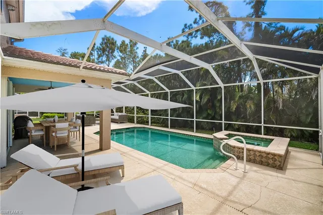 a patio with a table and chairs