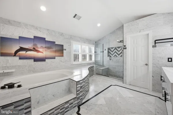 a spacious bathroom with a double vanity sink a toilet and shower