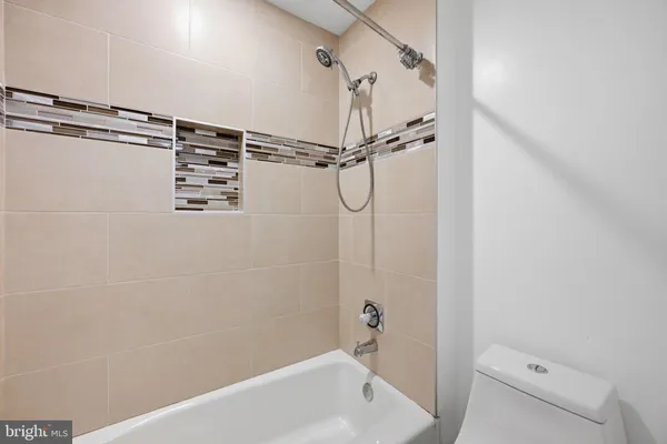 a bathroom with a shower and a bathtub