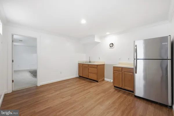 a kitchen with stainless steel appliances a refrigerator and a sink