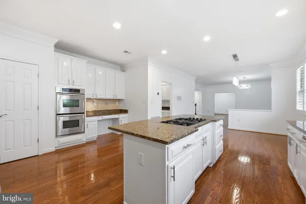 a kitchen with a stove and a sink
