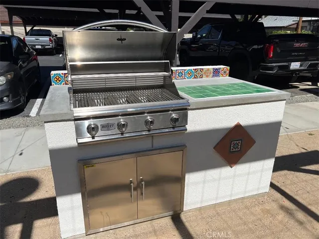 a stove top oven sitting inside of a kitchen