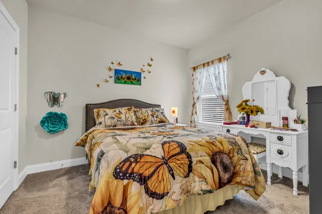 a bedroom with a bed and window