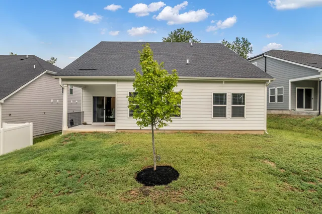 a house view with a garden space