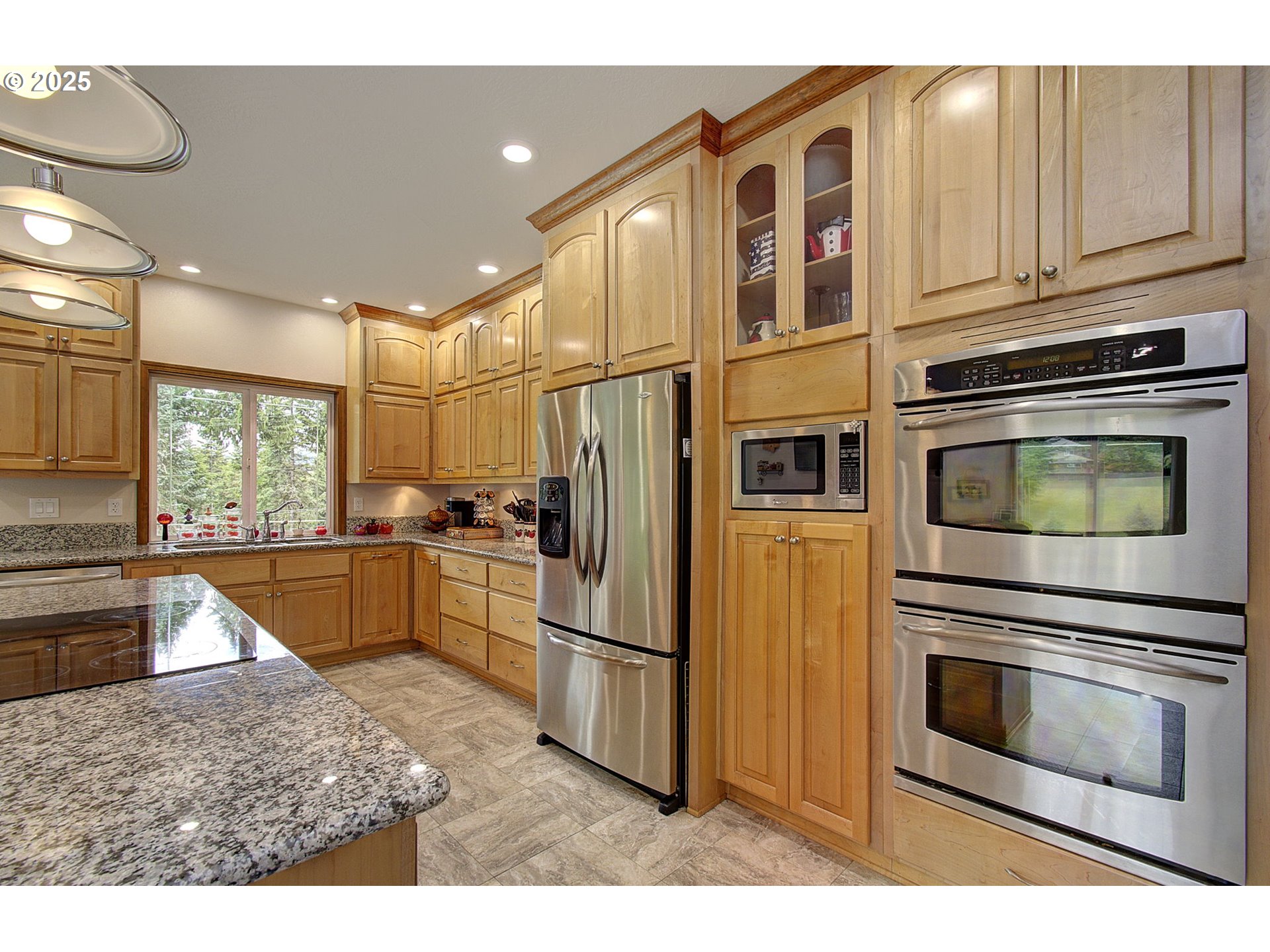 18229 Haven Acres Road Clatskanie, OR 97016 - Photo 21 of 45 a kitchen with stainless steel appliances granite countertop a refrigerator and a stove top oven