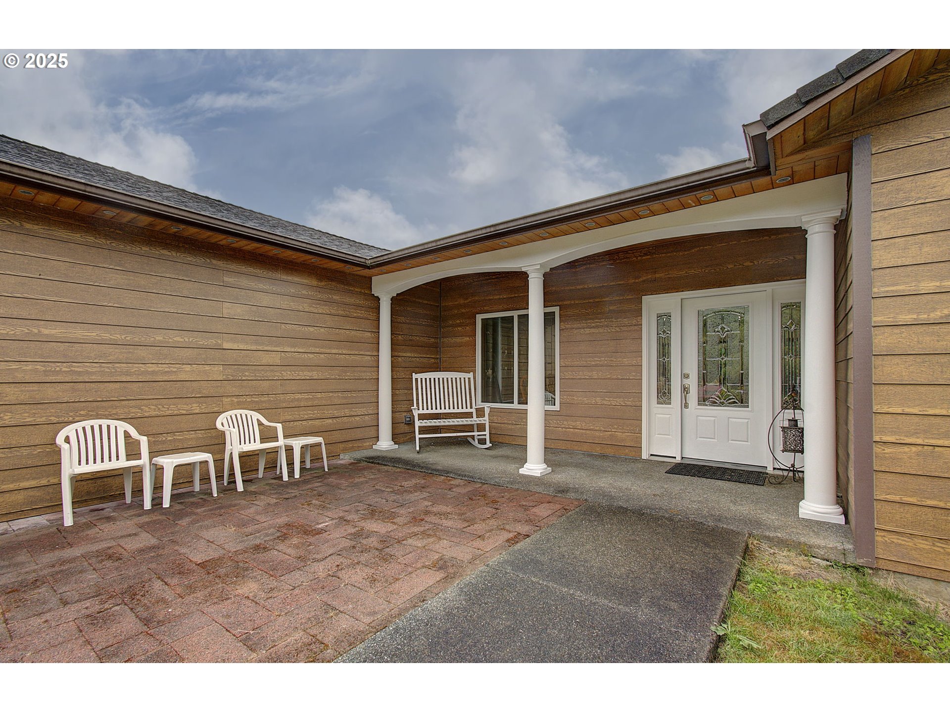 18229 Haven Acres Road Clatskanie, OR 97016 - Photo 6 of 45 a backyard of a house with table and chairs