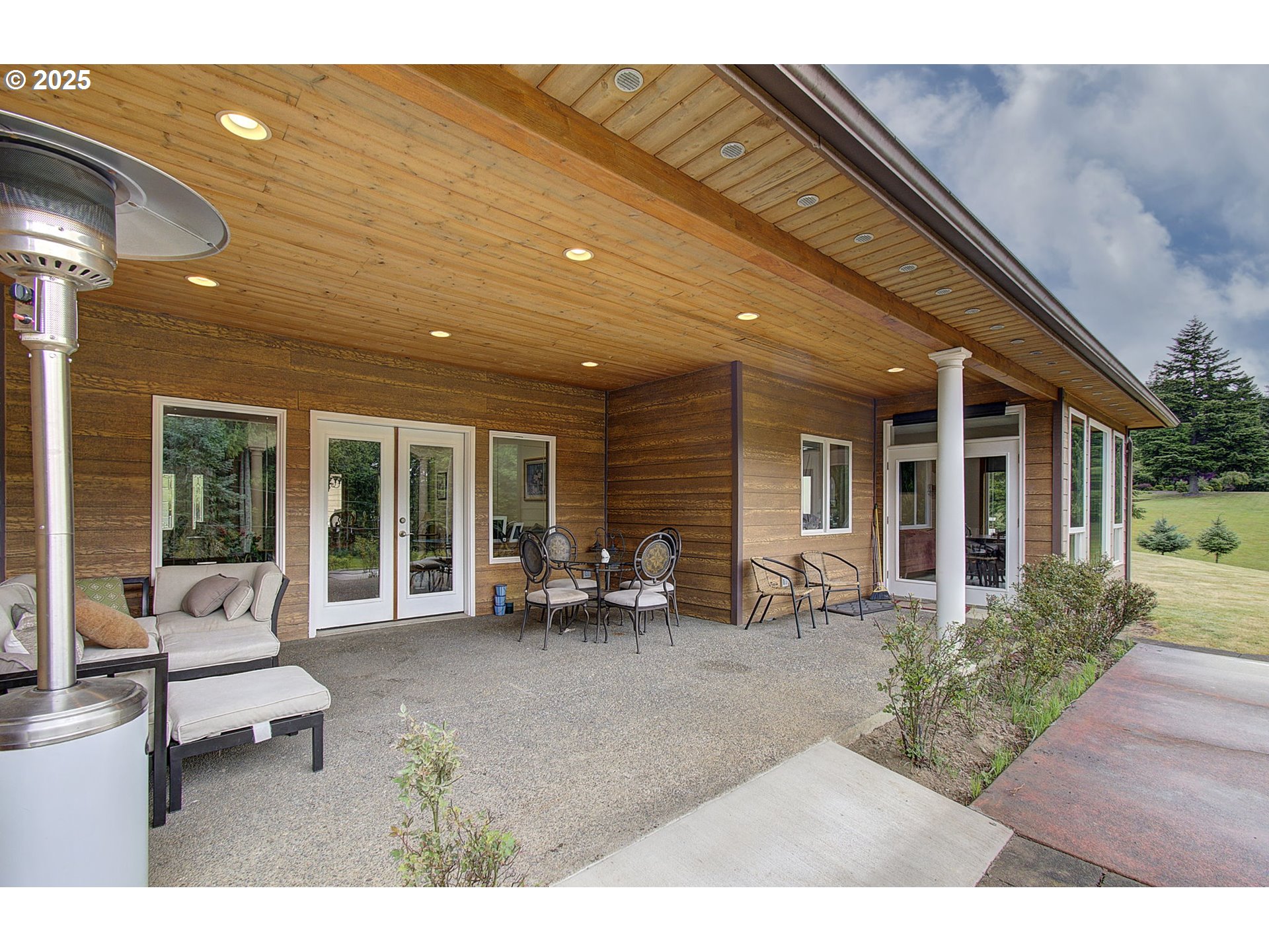 18229 Haven Acres Road Clatskanie, OR 97016 - Photo 7 of 45 a backyard of a house with outdoor seating