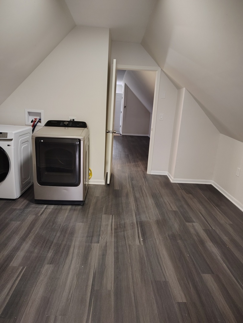 5740 South Elizabeth Street Chicago, IL 60636 - Photo 21 of 45 a view of a livingroom with wooden floor and a fireplace