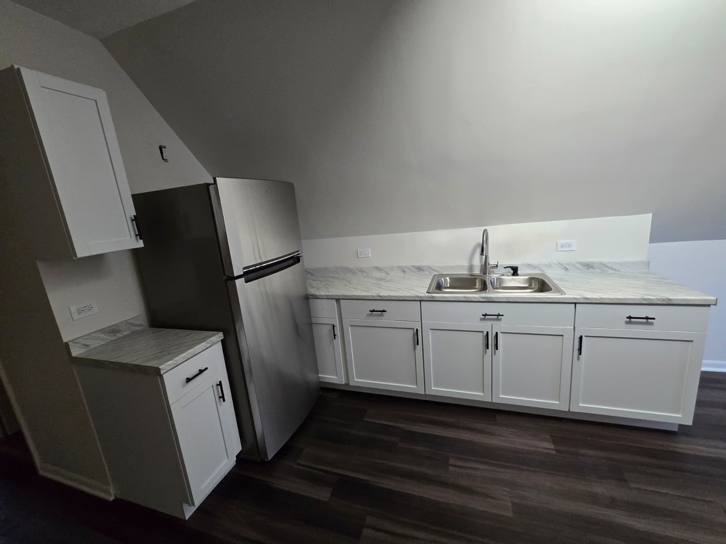 5740 South Elizabeth Street Chicago, IL 60636 - Photo 23 of 45 a kitchen with a sink and refrigerator