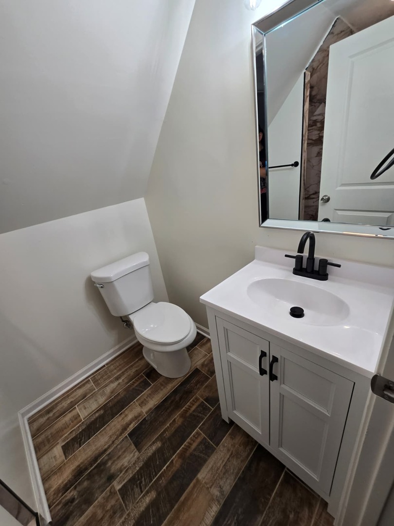 5740 South Elizabeth Street Chicago, IL 60636 - Photo 25 of 45 a bathroom with a sink and a mirror