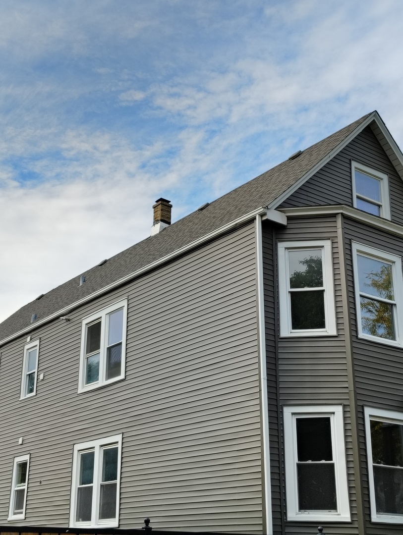 5740 South Elizabeth Street Chicago, IL 60636 - Photo 3 of 45 a front view of a house with garage