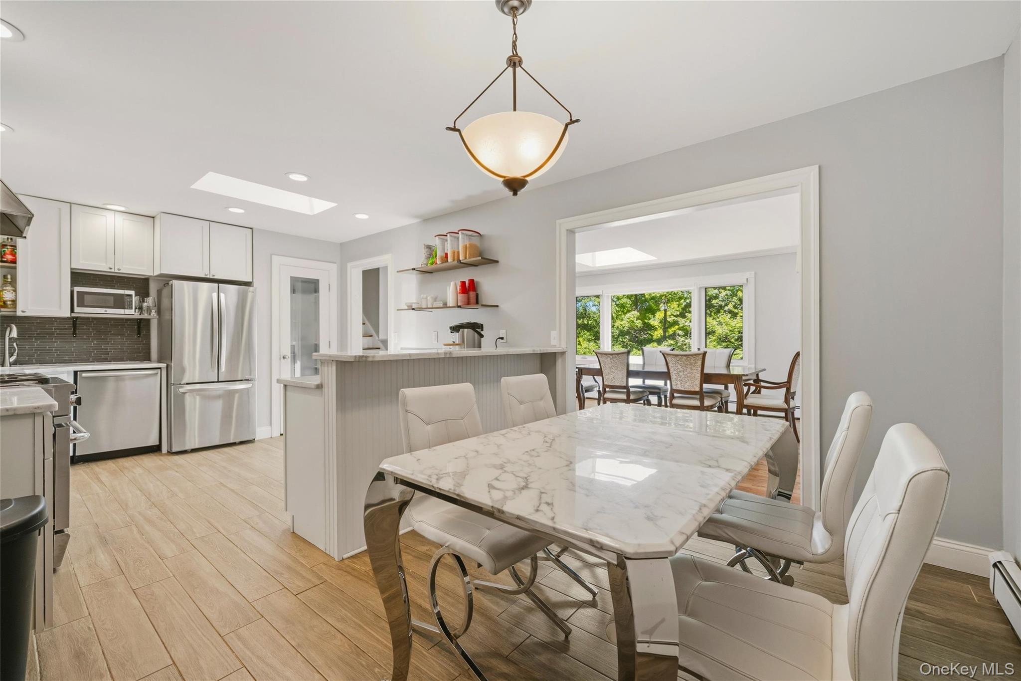 44 Sayer Road Blooming Grove, NY 10914 - Photo 8 of 39 a kitchen with kitchen island a refrigerator and wooden floor