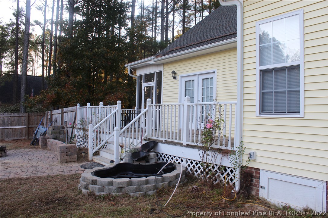 678 Tilghman Road Coats, NC 27521 - Photo 12 of 47 a view of a house with backyard and sitting area