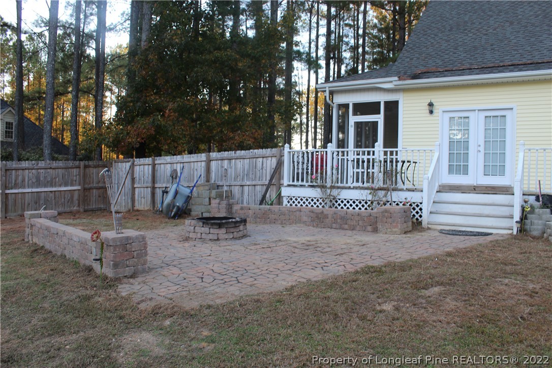 678 Tilghman Road Coats, NC 27521 - Photo 13 of 47 a view of a house with a yard and wooden fence