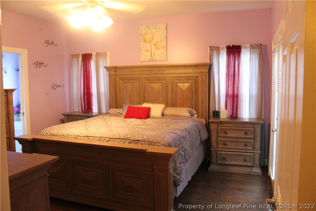 678 Tilghman Road Coats, NC 27521 - Photo 16 of 47 a bedroom with a bed and a dresser