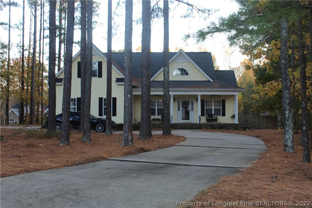 678 Tilghman Road Coats, NC 27521 - Photo 3 of 47 a front view of a house with sitting area
