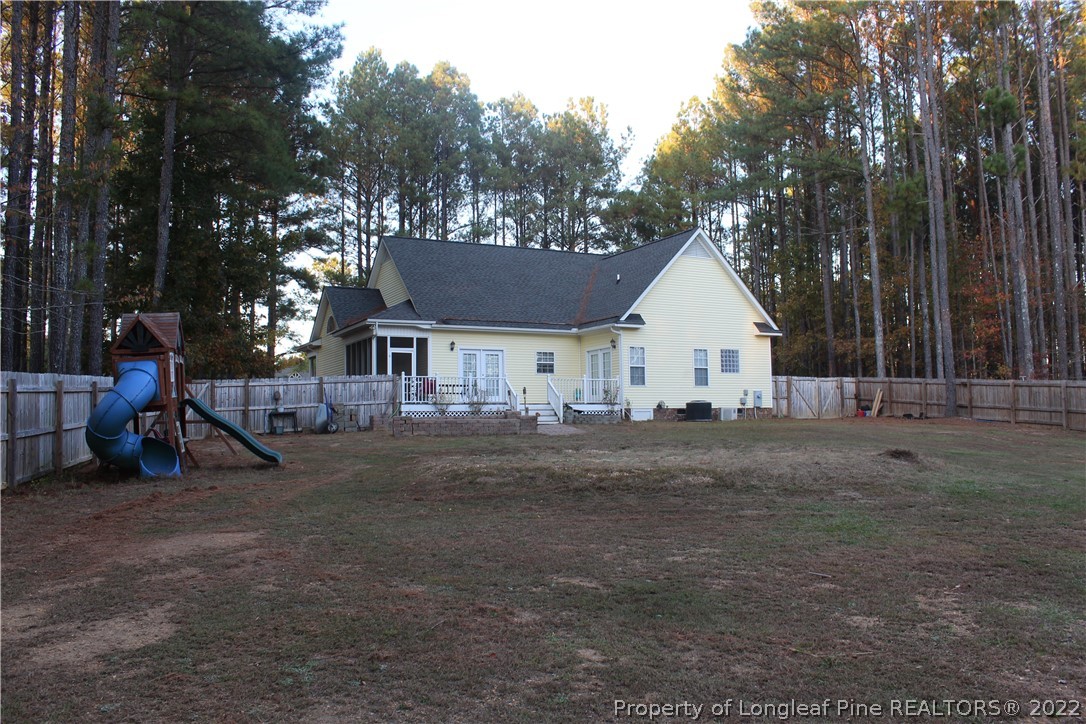 678 Tilghman Road Coats, NC 27521 - Photo 8 of 47 a view of house with outdoor space