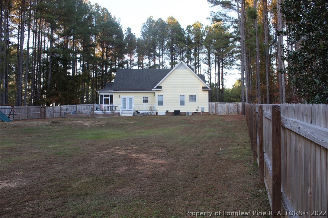 678 Tilghman Road Coats, NC 27521 - Photo 9 of 47 a view of a house with a yard