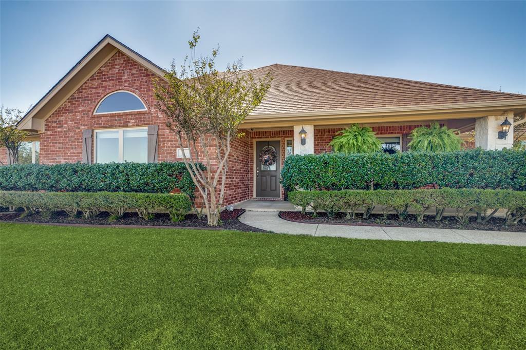 13064 Highland Court Forney, TX 75126 - Photo 1 of 25 a front view of a house with a yard and garage