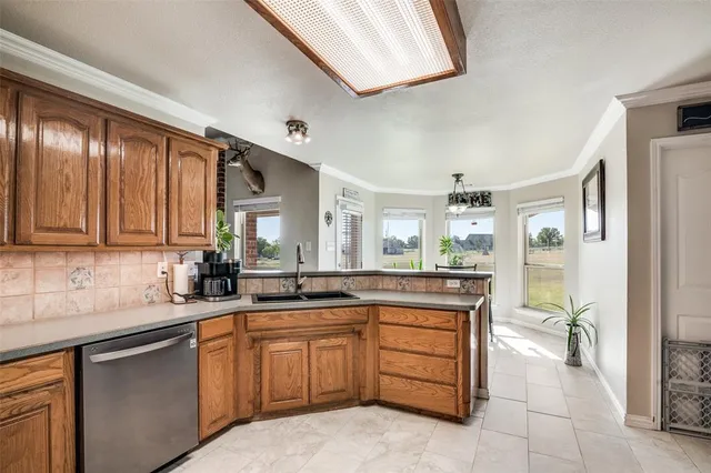 a kitchen with a sink and cabinets